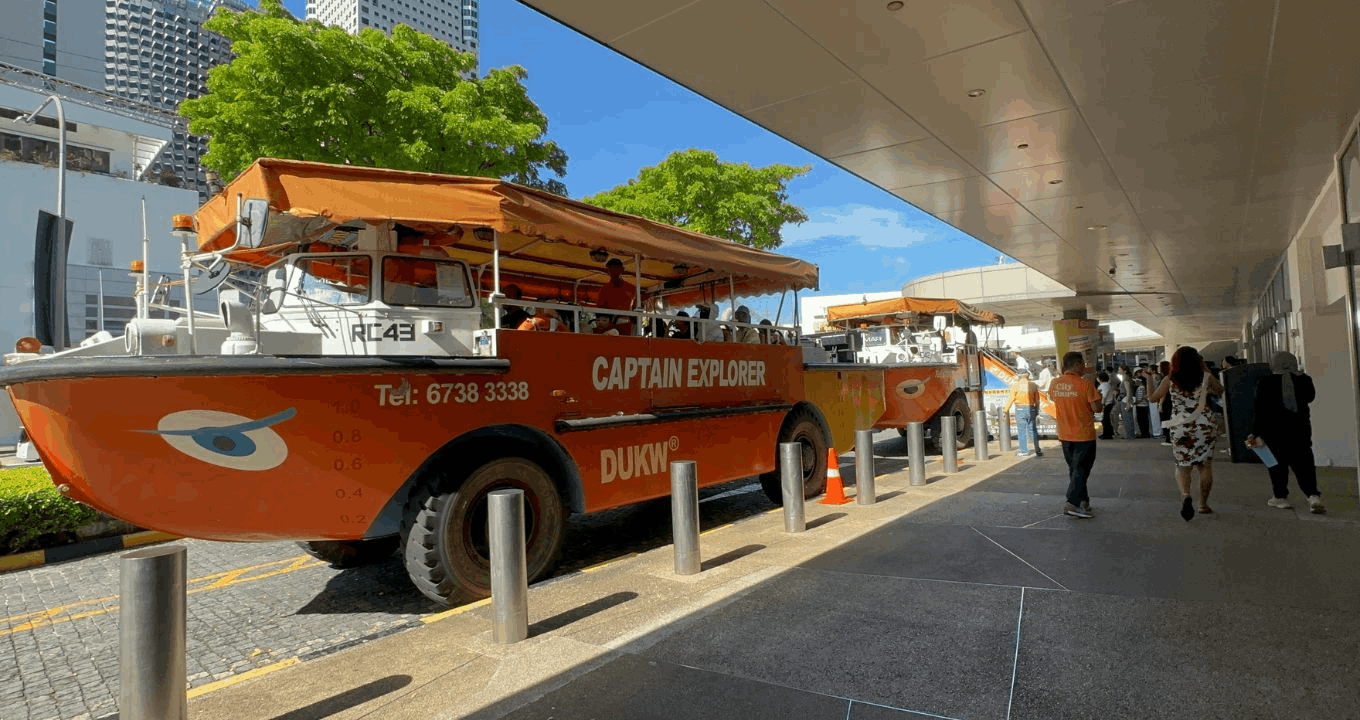 Captain Explorer DUKW tour vehicles ready for passengers outside Marina Square in Singapore.
