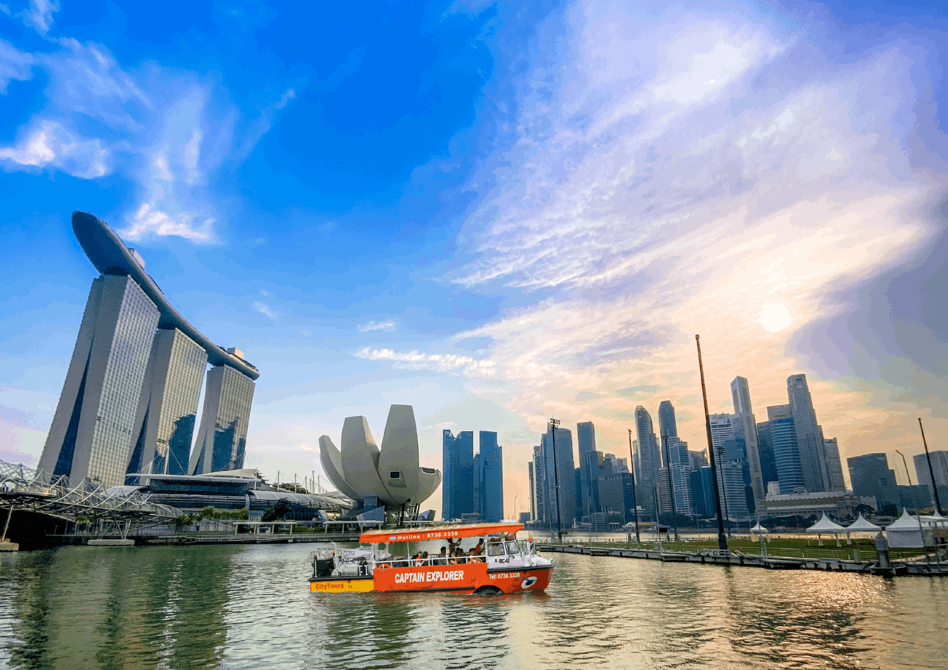 Captain Explorer DUKW Tour cruising along Marina Bay with Singapore skyline views, a memorable paid sightseeing experience for budget travellers.