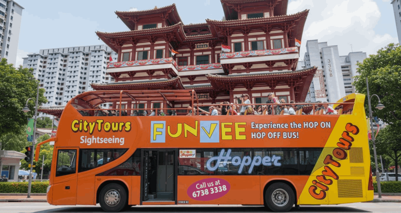 FunVee Hop-On Hop-Off Bus passing through Chinatown in Singapore, a convenient sightseeing option for first-time visitors exploring the city.