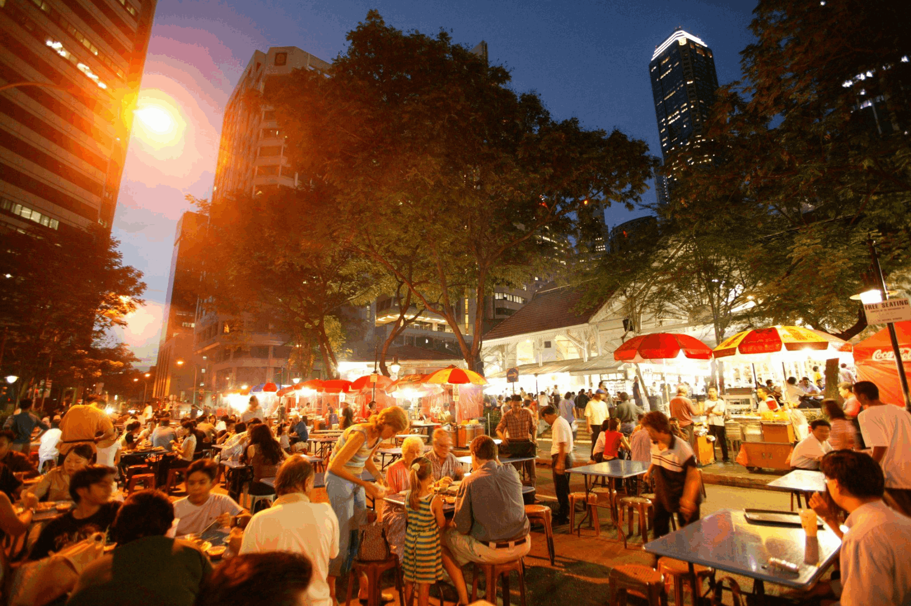 Evening street food stalls at Lau Pa Sat in Singapore, a popular hawker dining spot for budget travellers looking for affordable local food.