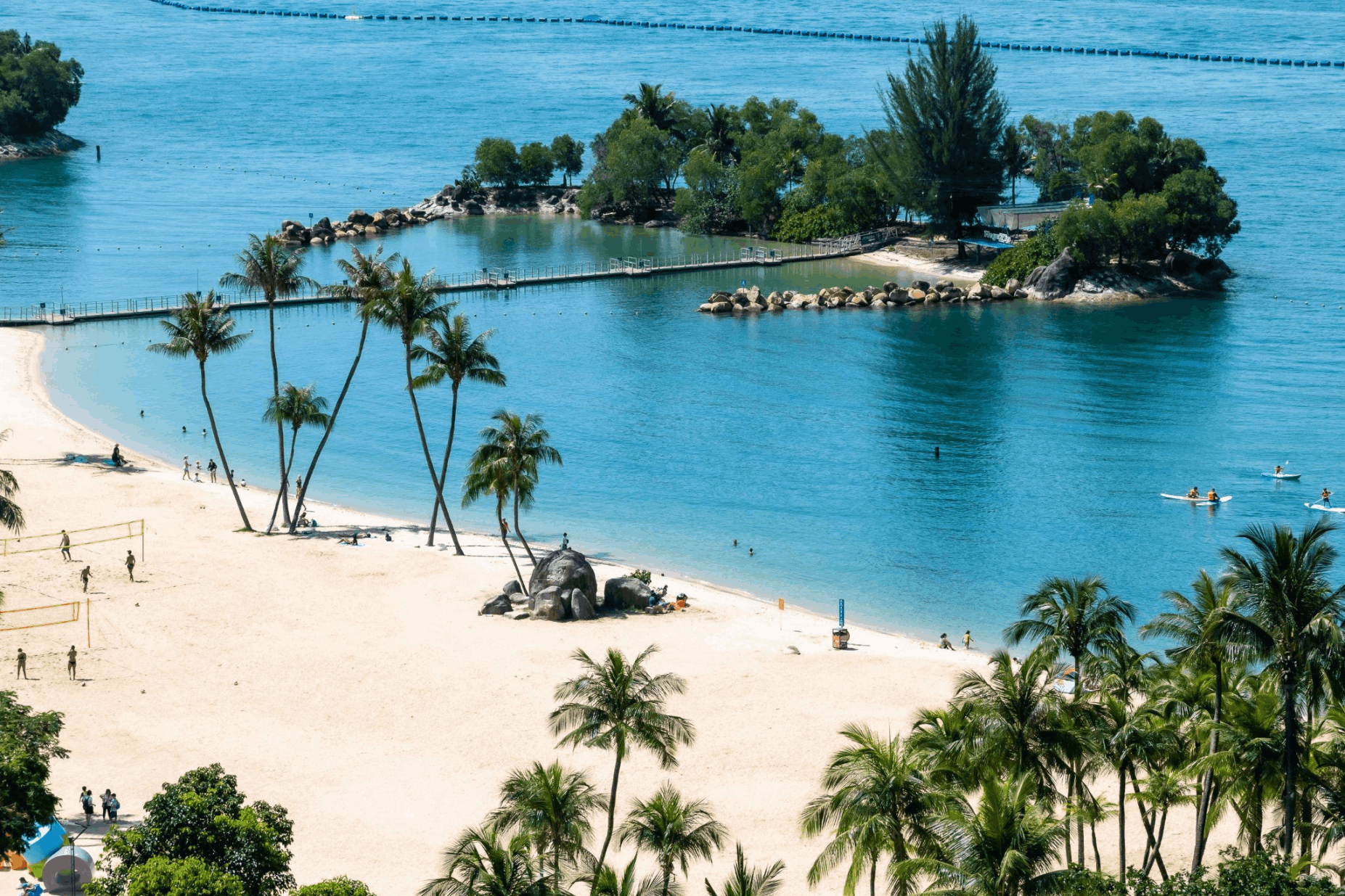Sentosa beach with turquoise waters and palm trees, a relaxing island stop for first-time visitors planning a 3-day Singapore itinerary.
